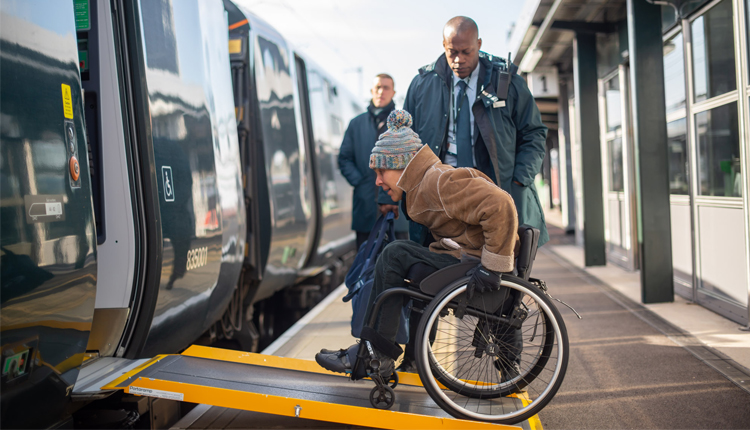 Man in wheelchair accessing a GWR train